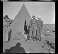 Elizabeth West, Frances West and Ted McClellan's son stand outside a tent near Convict Creek, Mammoth Lakes vicinity, 1915