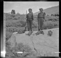 Frances and Elizabeth West pose with H. H. West's limit of sage hen, Mammoth Lakes vicinity, 1915