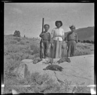 Frances West, Minnie West and Elizabeth West pose with H. H. West's limit of sage hen, Mammoth Lakes vicinity, 1915