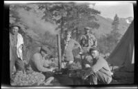 Members of the West, Schmitz and Scullin camping party cook food at their campsite near Convict Lake, Mammoth Lakes vicinity, 1918