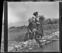 H. H. West and Ellen Lorene (Pinkie) Lemberger pose with a rabbit that West had just shot, Crafton, 1901