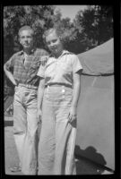 Hebard West and Josephine Cover pose for a photograph by a tent, Crestline, 1938