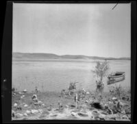 A rowboat floats in Crane Lake, Gorman vicinity, circa 1910s