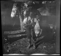 Dave F. Smith poses with ducks and a goose, Gorman vicinity, circa 1910s