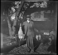 H. H. West poses with a goose and a couple ducks, Gorman vicinity, circa 1910s