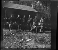 Alamo Gun Club members and members of Jim Jeffries' hunting party stand outside the clubhouse, Gorman vicinity, circa 1910s