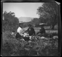 Louise Ambrose, Chas Rucher and Nella A. West lunch near Devils Gate, Pasadena, 1899