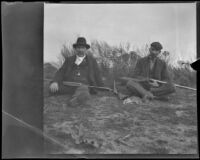 George M. West and Frank Lemberger pose for a photograph during a rabbit shoot, Duarte, about 1897