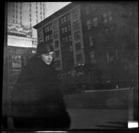 Woman walks down Fifth Avenue, New York, 1914
