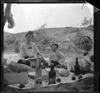 Mary West, Frances West and Wilfrid M. Cline eat lunch at Elizabeth Lake, Lancaster vicinity, about 1912