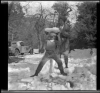 Mertie West places a block of snow on H. H. West, Jr.'s head, Redlands vicinity, about 1930