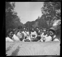 Mertie Whitaker with a group of people on a boat, Fresno, 1901