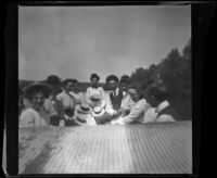 Mertie Whitaker with a group of people on a boat, Fresno, 1901