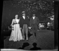 Addie Prickett, Ora Prickett and George Prickett stand on a lawn, Fresno, 1901