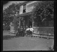 Will Mead and other ranch workers pose in front of the bunk house, Glendale, 1898