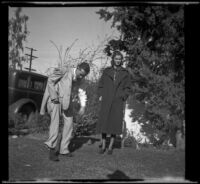H. H. West, Jr. and Jane Sage stand on the front lawn of the Siemsen home, Glendale, 1938