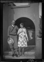 Neil Wells and Frances West Wells pose in front of an archway, Glendale, about 1930
