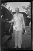 Mayor John C. Porter poses next to a car, Glendale, 1932