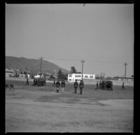 R. O. T. C. cadets marching across Glendale High School's football field while other cadets look on, Glendale, 1936