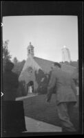 Man and woman walk up the path to the Wee Kirk o' the Heather, Glendale, 1939