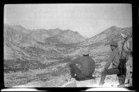Cleo Swain and Glen Velzy gaze toward Bull Frog Lake and Kearsarge Pass during a trip to Gardner Creek, about 1919