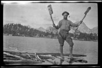 Glen Velzy with a raft and paddles that he found at Kearsarge Lake, about 1919