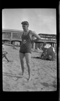 Paul Armstrong stands on the beach, Hermosa Beach, about 1932