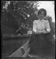 Emma Manker sits in a boat while Independence (Inda) Stevens and Margaret Burris are in another boat behind, Red Oak, 1900