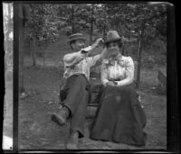 Independence (Inda) Stevens adjusts Emma Manker's hat, Elliott vicinity, 1900