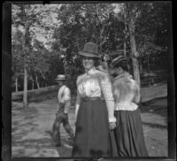 Emma Manker stands with three people behind her, Elliott vicinity, 1900