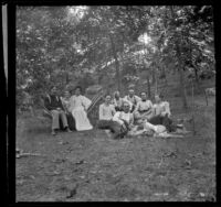 Group of H. H. West's friends and cousins pose in the woods, Elliott vicinity, 1900