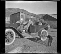 Minnie West and Frances West sit in H. H. West's Buick, Little Lake, about 1914