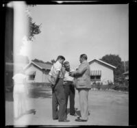 Frank E. Hand, Jr. and two others have a conversation at the Independent Order of Foresters Sanatorium, San Fernando vicinity, 1937