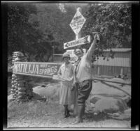 Mertie West and Nina Meyers pose next to signage for Matilija Hot Springs, Ojai vicinity, about 1925