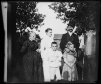 Lucy Mead, Fannie Mead Biddick, Walter Biddick, William Mead, and Daniel Mead stand together, Elliott vicinity, 1900