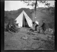 West and Lemberger mining party sits around their campsite, Monrovia 1898