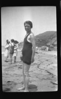 Mertie West standing on the beach, Malibu, about 1930