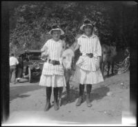 Frances and Elizabeth West posing with a donkey, San Fernando vicinity, about 1915