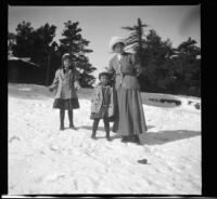 Elizabeth West, Frances West and Mary West posing in the snow, Mount Wilson, 1909