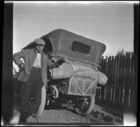 H. H. West posing next to his Buick, Mendocino County vicinity, 1915
