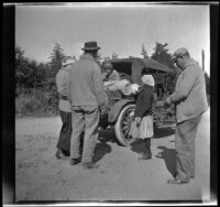 Mary West, Glen Velzy, Bessie Velzy, Frances West and Al Schmitz gather around the Velzy's car, Mendocino County, 1915