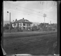Upscale homes line a wide street, Pasadena, 1899