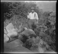 William Shaw holds a fish he caught in Pine Creek, Inyo County vicinity, about 1930