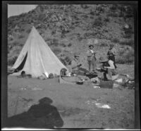 Otto Schmitz, Al Schmitz, Elmer Cole and Charles Stavnow taking a meal in their campsite, Los Padres National Forest, about 1915