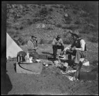 Otto Schmitz, Elmer Cole and Charles Stavnow taking a meal in their campsite, Los Padres National Forest, about 1915