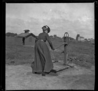 Wilhelmina West working a water pump, Pacific Junction, 1900