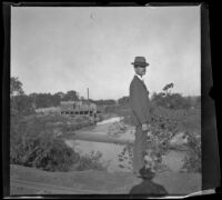 Sam Longstreet stands by the Nishnabotna River, Red Oak, 1900