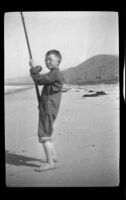 H. H. West, Jr. posing with a fishing rod at Rincon Point, Carpinteria vicinity, about 1924