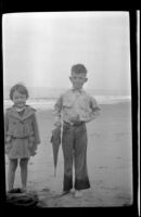 Eleanor Shaw and H. H. West, Jr. posing with a fish near Rincon Point, Carpinteria vicinity, about 1924