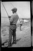 Forrest Whitaker and Everett Shaw surf fishing near Rincon Point, Carpinteria vicinity, about 1924